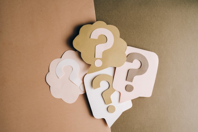 Paper cutouts of question marks